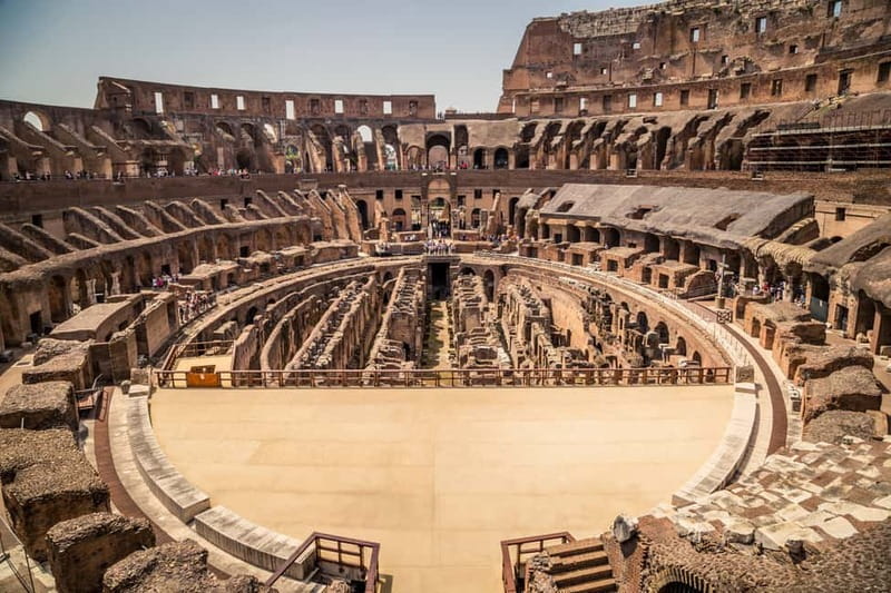 Rome: Colosseum and Ancient Rome Small Group Guided Tour - Entering the Colosseum: construction genius meets arena drama