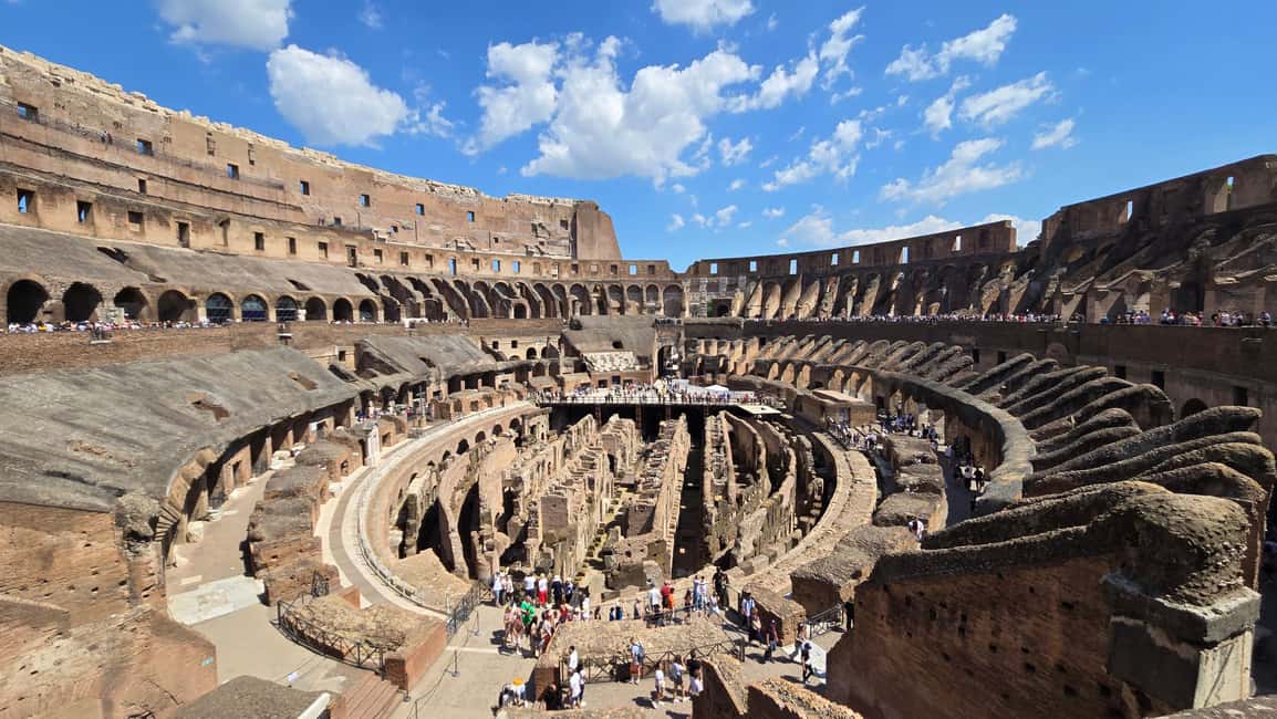 Rome: Colosseum Express Tour and Roman Forum Access - Entering the Colosseum: dedicated entrance, headsets, and the stories that click
